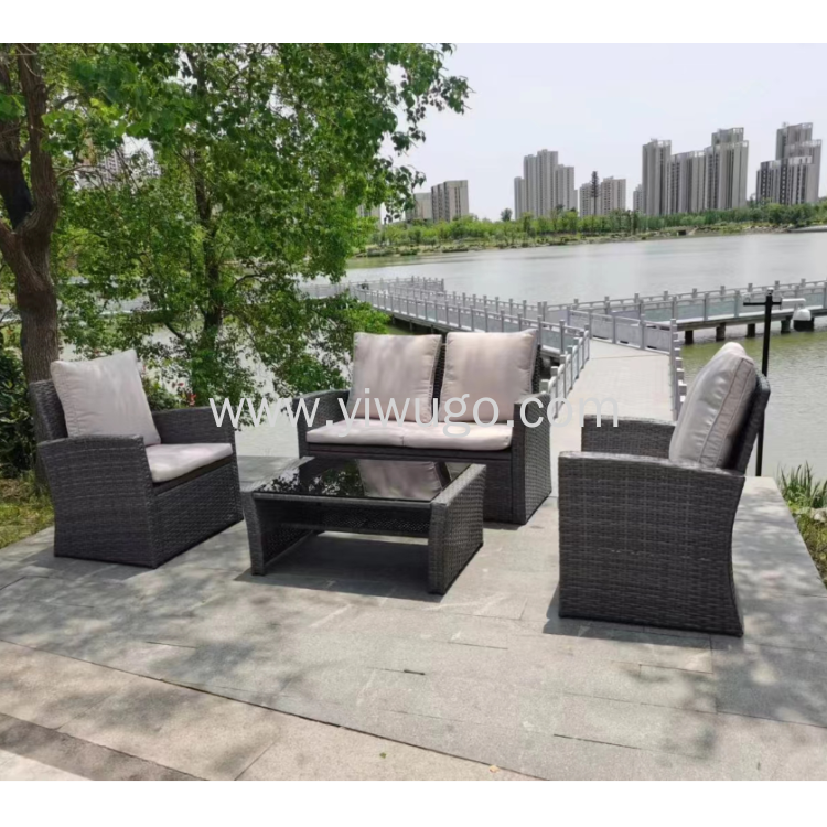 New luxury rattan sofa four pieces of glass table and chair leisure balcony garden courtyard rattan set