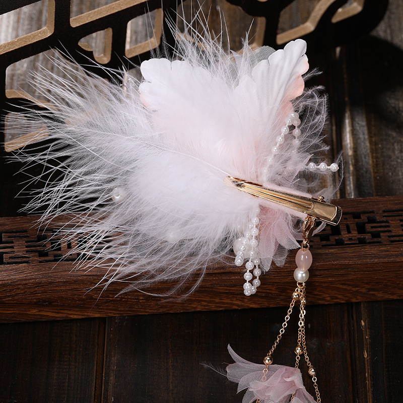 Factory direct supply of light pink fabric firework chicken feather decorated women's metal hairpins with long tassels, ancient-style Hanfu accessories Application Scenario