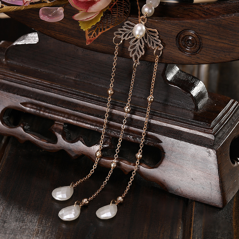 Fashionable pearl long tassel style women's ancient style flanged fabric large flower decoration women's elegant metal pair Application Scenario
