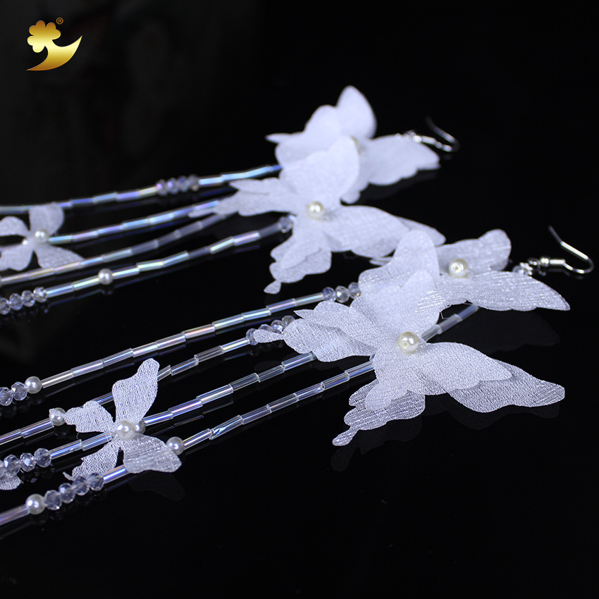 Korean-style crystal tassel earrings, fashionable and simple white butterfly jewelry, women's pure handcrafted long tassel earrings Application Scenario