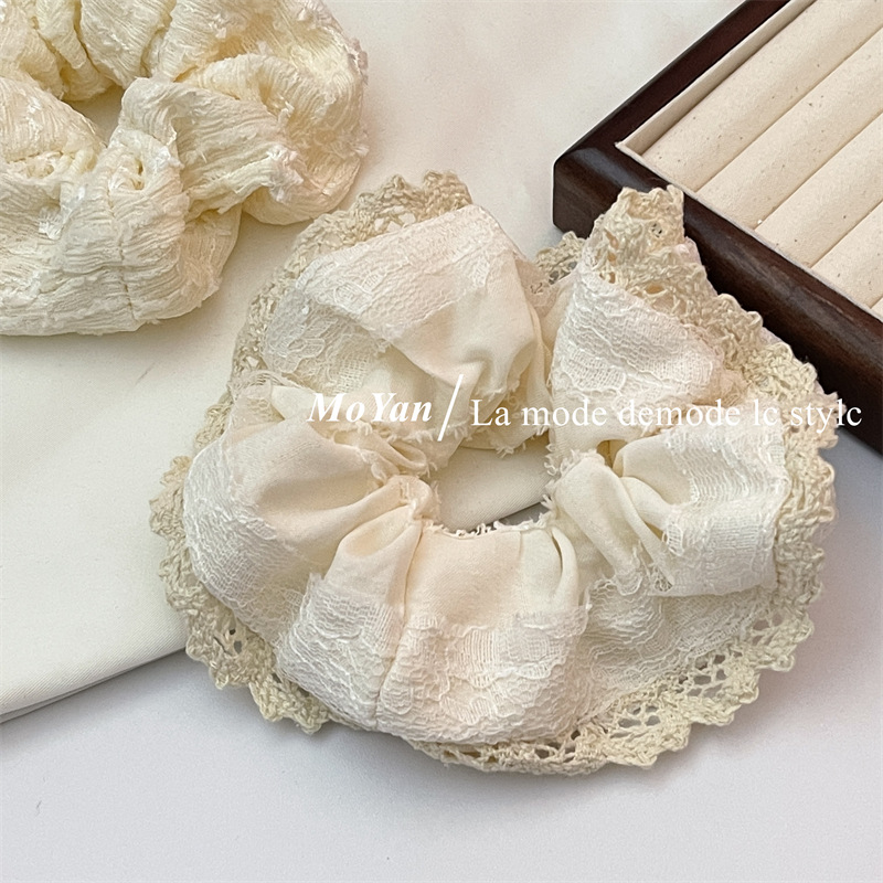 A small chanel-style cream white lace-trimmed large intestine hair band with a high-end feminine look, a bun hair tie, a hair tie, and an early spring hair accessory pic 11