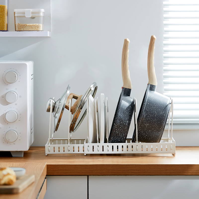 The adjustable kitchen storage rack can store multiple layers of kitchenware, cutting boards, cutting boards, pot LIDS, pot racks and other items. It is a telescopic storage rack pic 18