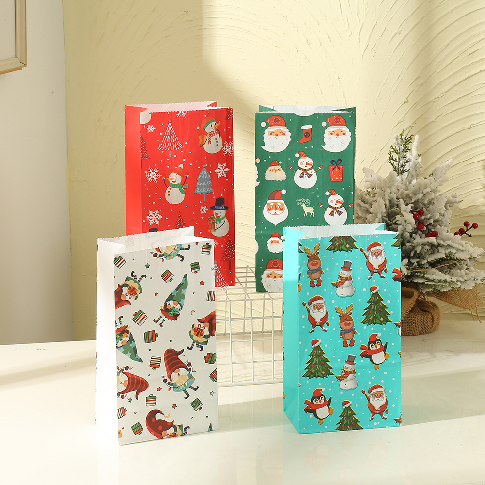 Wholesale of Christmas cartoon kraft paper handbags in stock, universal gifts for birthday and festival parties, and candy packaging bags pic 1