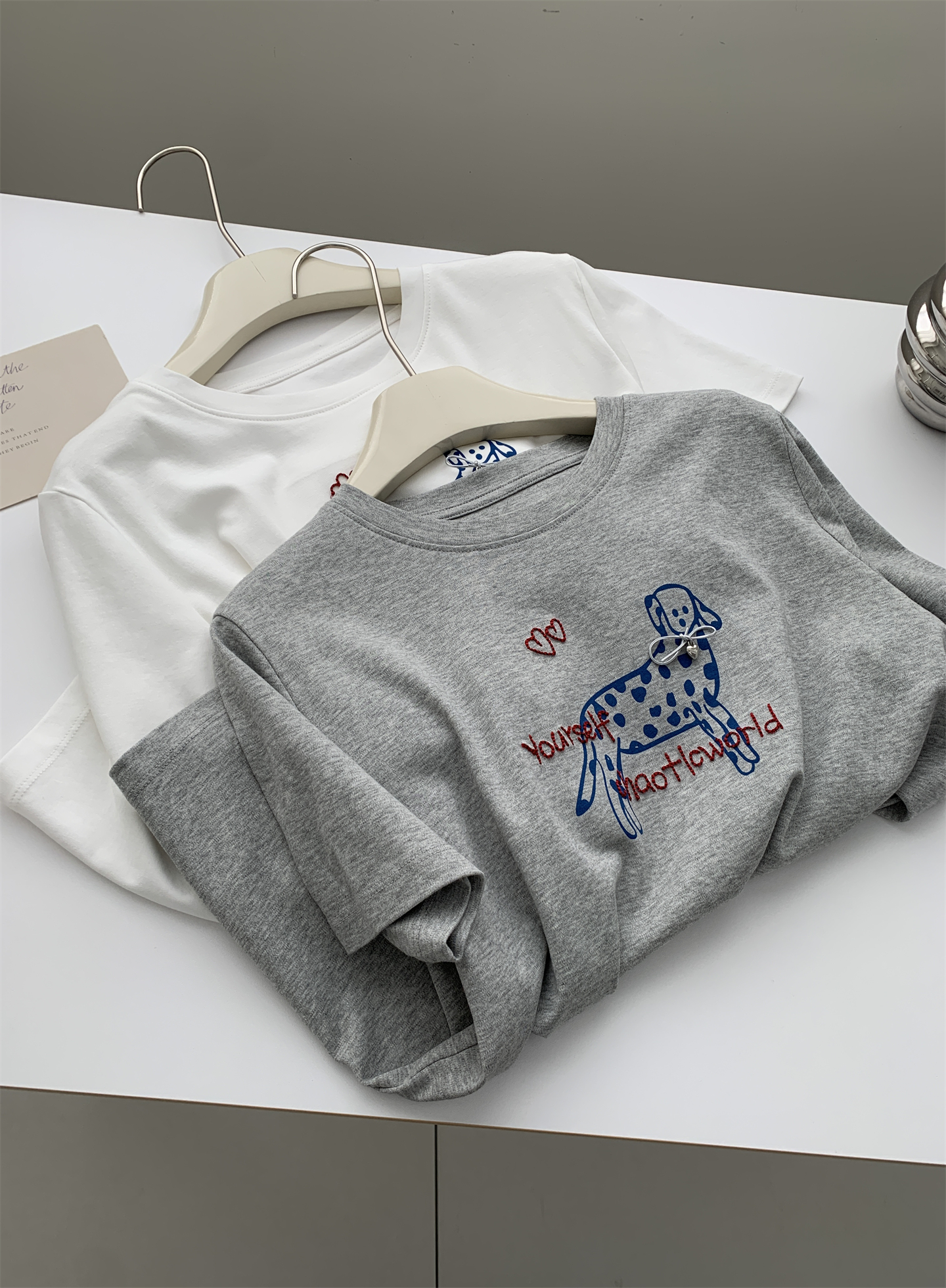 A trendy Korean-style loose and casual short-sleeved T-shirt with a bow and spotted dog print for women in summer, featuring pure cotton embroidery pic 14