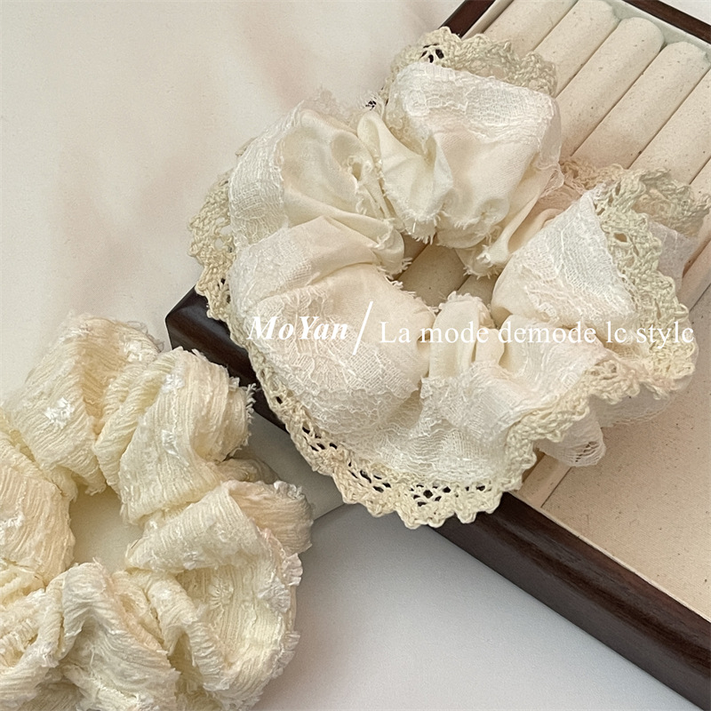 A small chanel-style cream white lace-trimmed large intestine hair band with a high-end feminine look, a bun hair tie, a hair tie, and an early spring hair accessory pic 10