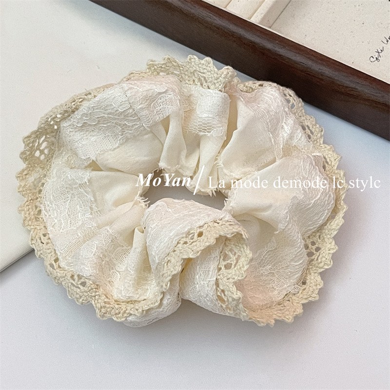 A small chanel-style cream white lace-trimmed large intestine hair band with a high-end feminine look, a bun hair tie, a hair tie, and an early spring hair accessory pic 6
