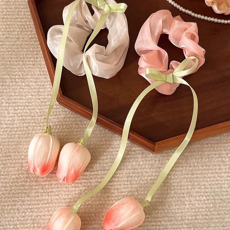 A retro French large intestine hair band for a woman with a simple and elegant ponytail bun. A hair tie, hair band, hair band and hair accessory for a woman pic 4