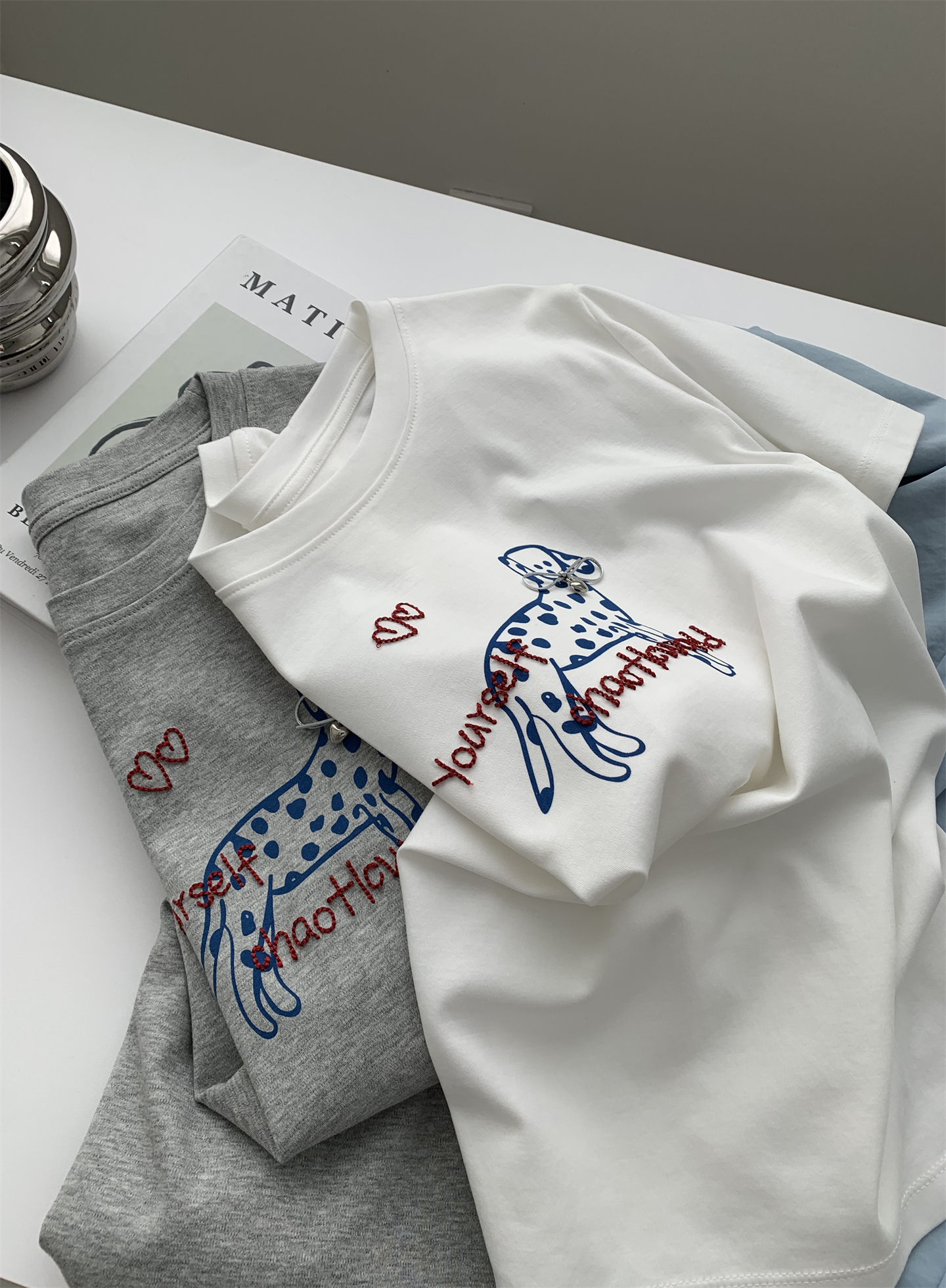 A trendy Korean-style loose and casual short-sleeved T-shirt with a bow and spotted dog print for women in summer, featuring pure cotton embroidery pic 9