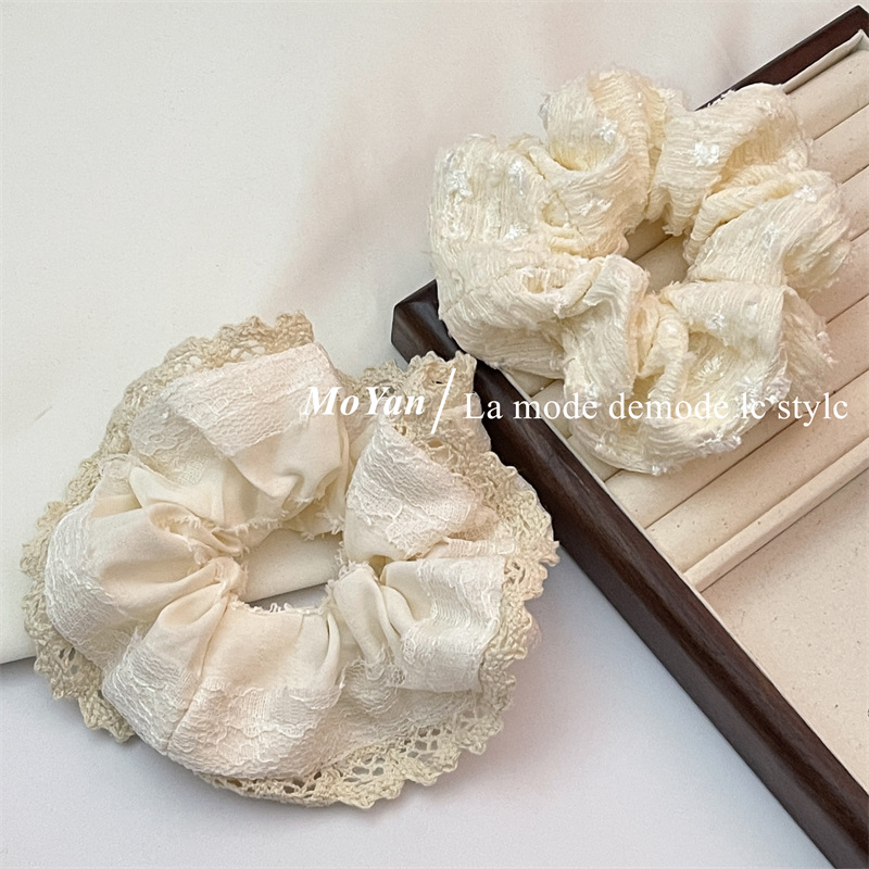 A small chanel-style cream white lace-trimmed large intestine hair band with a high-end feminine look, a bun hair tie, a hair tie, and an early spring hair accessory pic 13