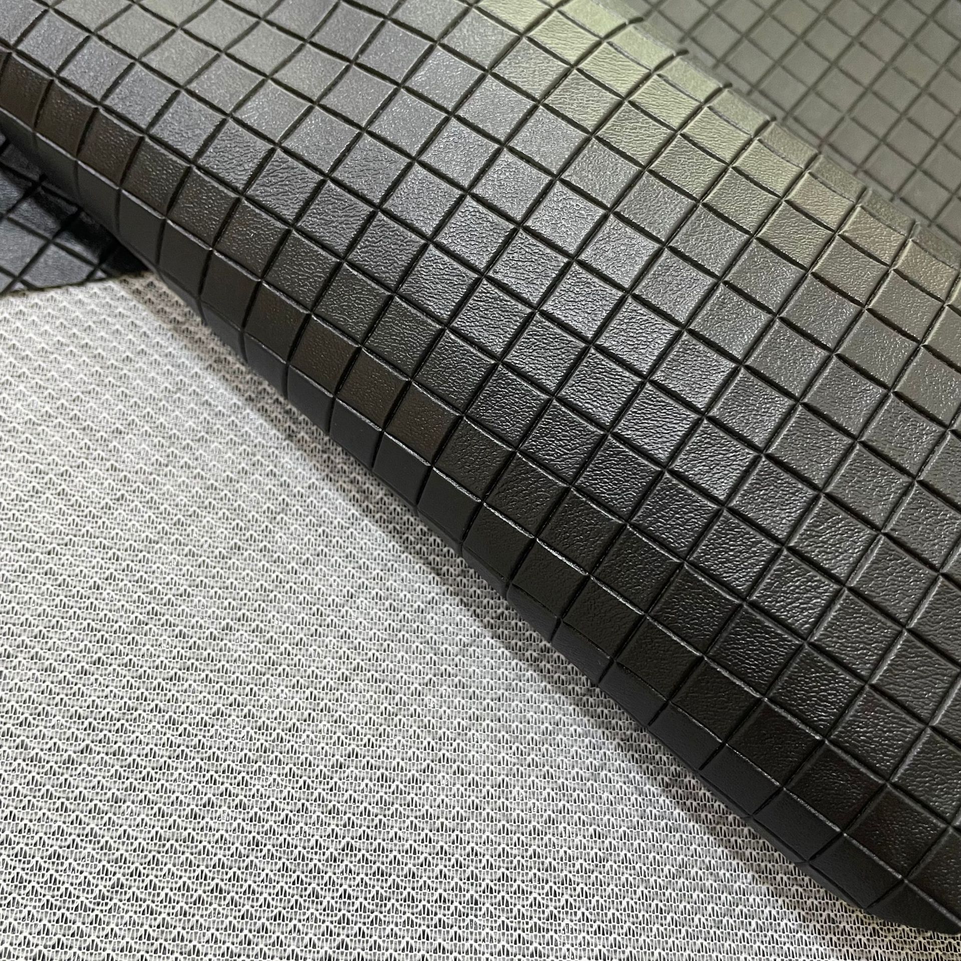 We are selling 1.6-meter-wide checkered patterned scratch-resistant fish-scale fabric for car and electric motorcycle seat covers in stock pic 5