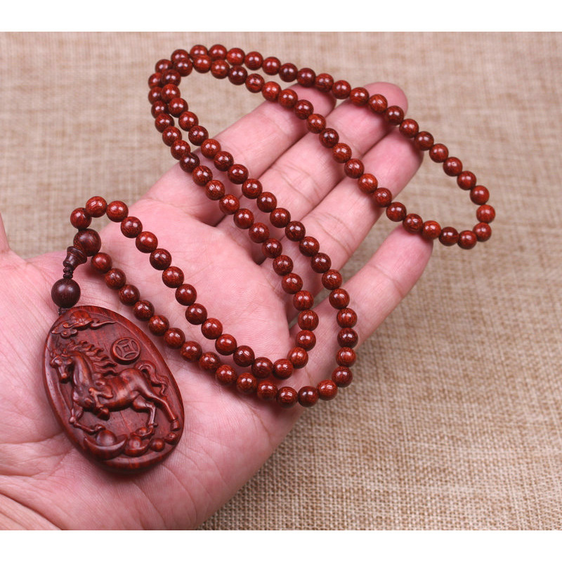 A cute red horse pendant necklace made of rosewood, featuring twelve zodiac animal carvings, and long sweater chains for both men and women pic 3