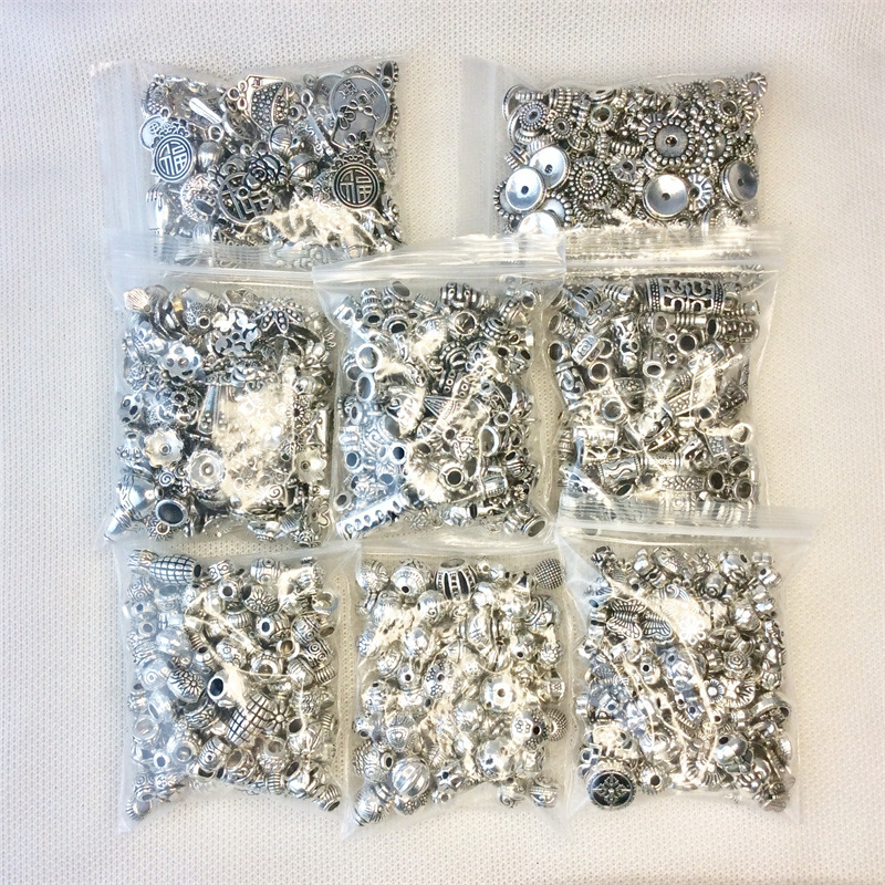 A 50g mixed bag of Tibetan silver bracelets, pendants, alloy jewelry accessories, diy flower trays, spacers, and drum beads pic 10