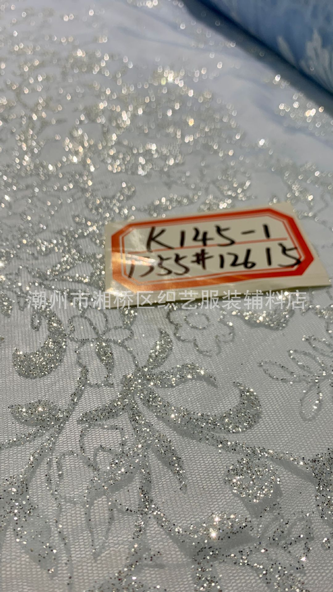 K145 patterned wedding dress fabric in stock, featuring a mesh fabric with gold sheets and gold spray patterns pic 7