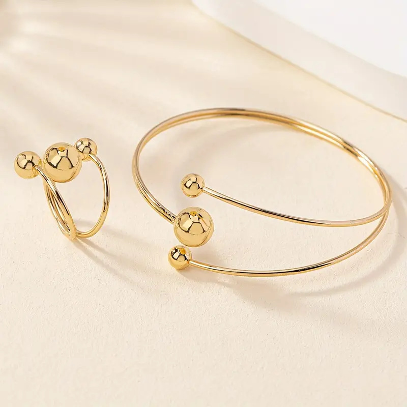 A simple, fashionable and personalized wrist and finger accessory set of gold and silver small balls with large balls in layers pic 5