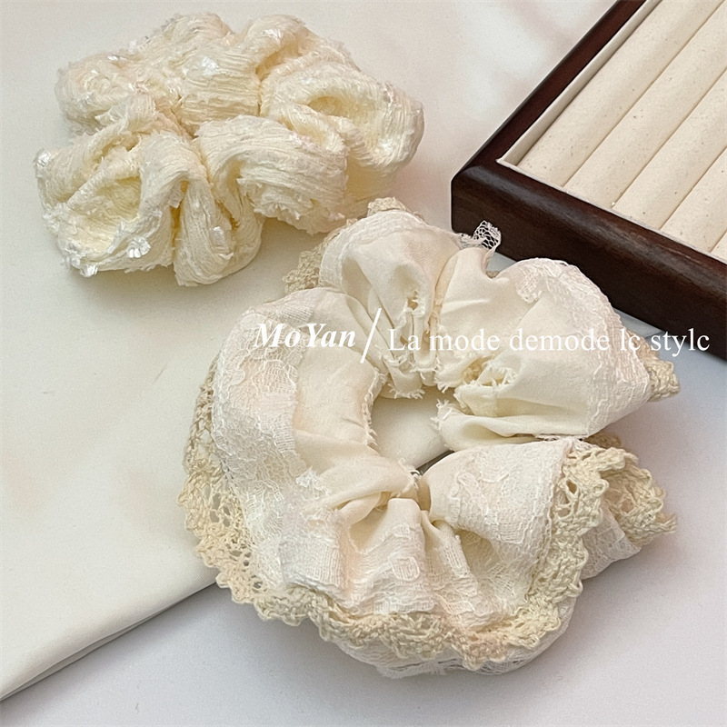 A small chanel-style cream white lace-trimmed large intestine hair band with a high-end feminine look, a bun hair tie, a hair tie, and an early spring hair accessory pic 16