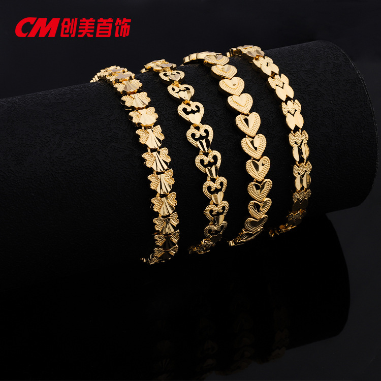 Chuangmei Jewelry offers wholesale 24K gold-plated heart-shaped butterfly bracelets for women, featuring a retro ethnic style and a luxurious wedding accessory pic 1