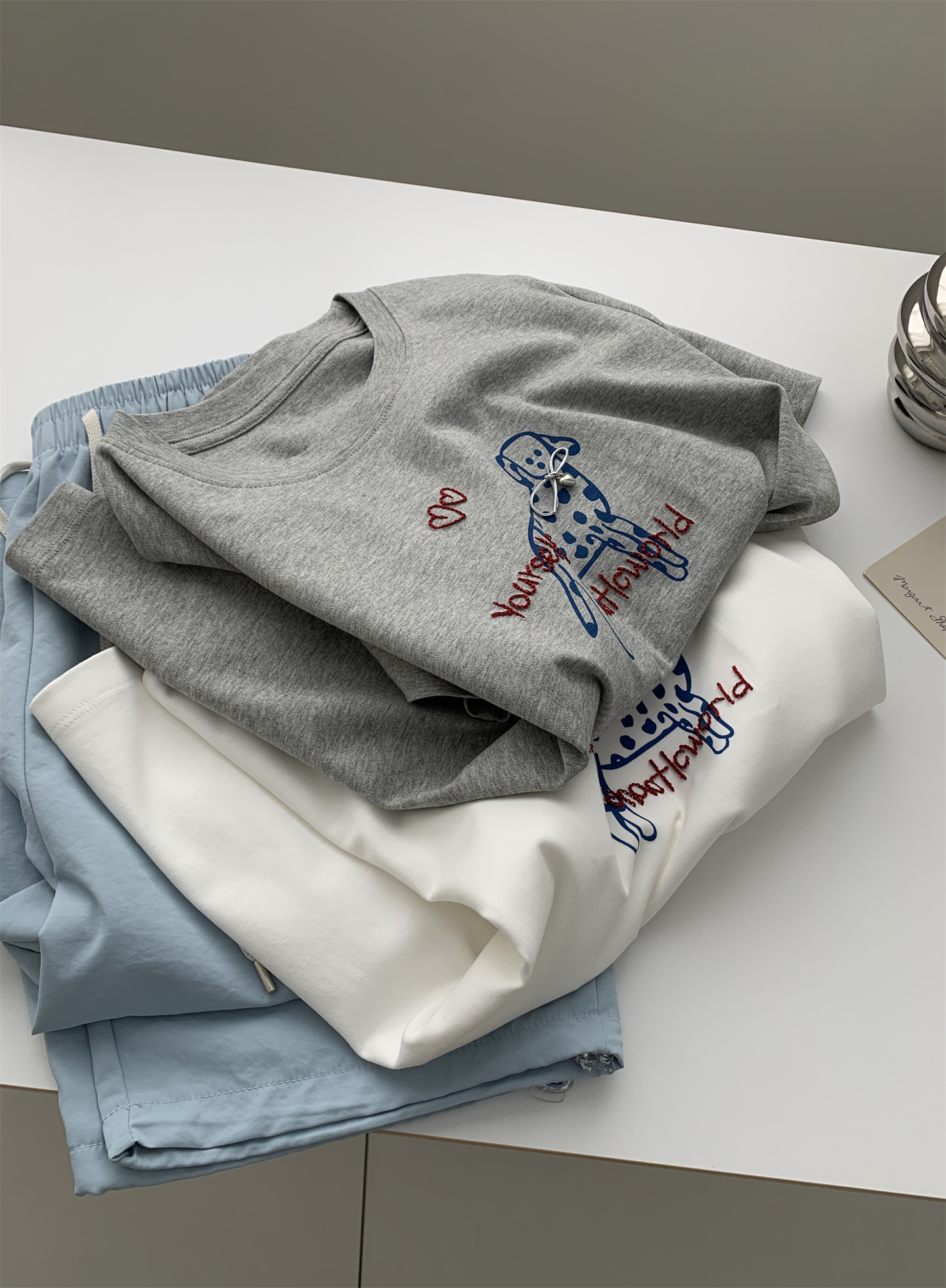 A trendy Korean-style loose and casual short-sleeved T-shirt with a bow and spotted dog print for women in summer, featuring pure cotton embroidery pic 19
