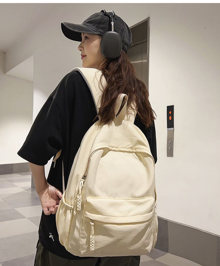 贝尔书包女生大学生简约黑色大容量初中生高中2024新款背包双肩包详情3