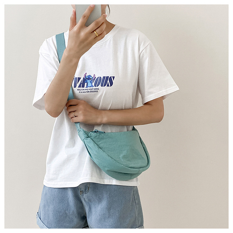 斜挎包女新款单肩包学生女包休闲包运动小包夏季帆布包日系饺子包详情18