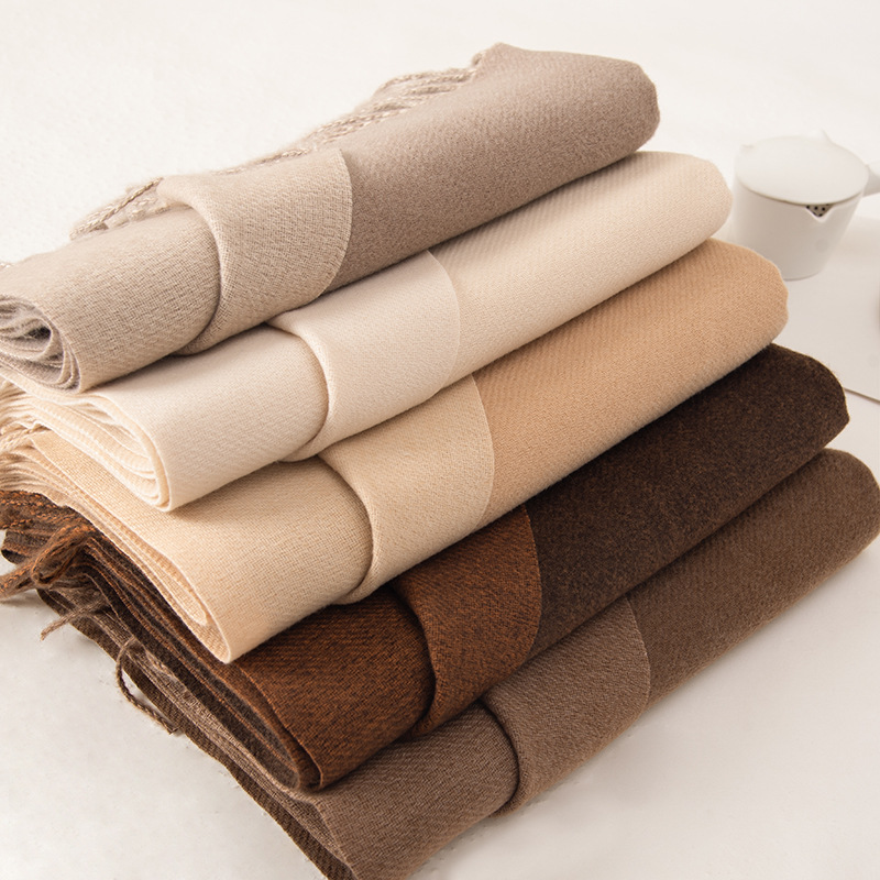 The 2023 new double-sided solid color macaron scarf for women is a bestseller in winter. It is fashionable and warm with faux cashmere tassels. Wholesale pic 1