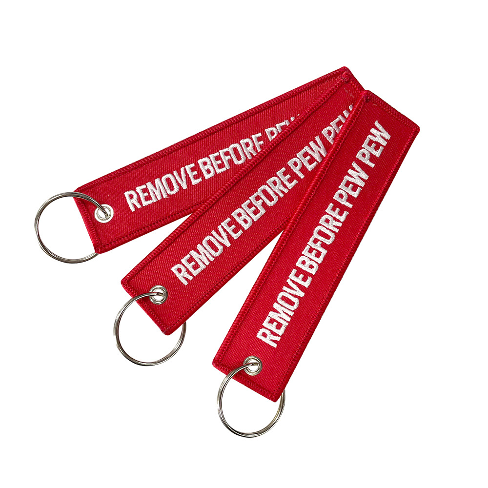 亚马逊刺绣红底白字飞行前摘除标签钥匙扣REMOVE BEFORE FLIGHT详情2