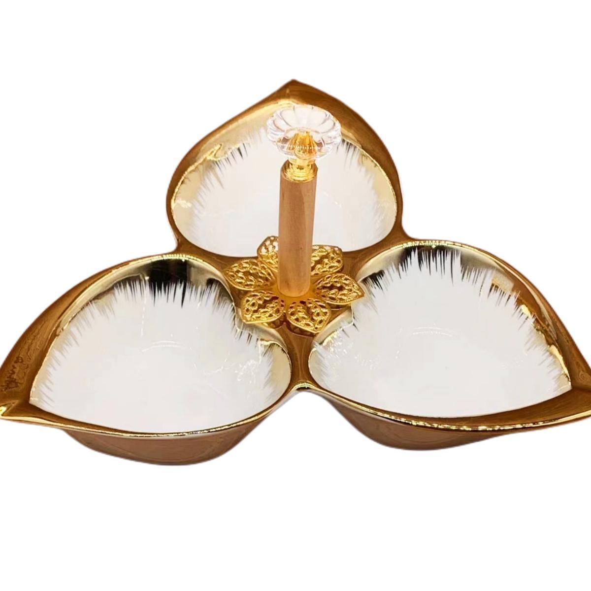 A pure white petal-shaped fruit platter with electroplated gold and multiple compartments, a hand-held restaurant banquet food platter pic 12