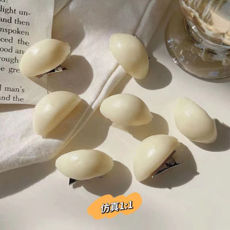 A funny and fun mini garlic hair clip, a bangs clip, and a creative garlic clove hair clip for your best friend as a gift and hair accessory pic 3
