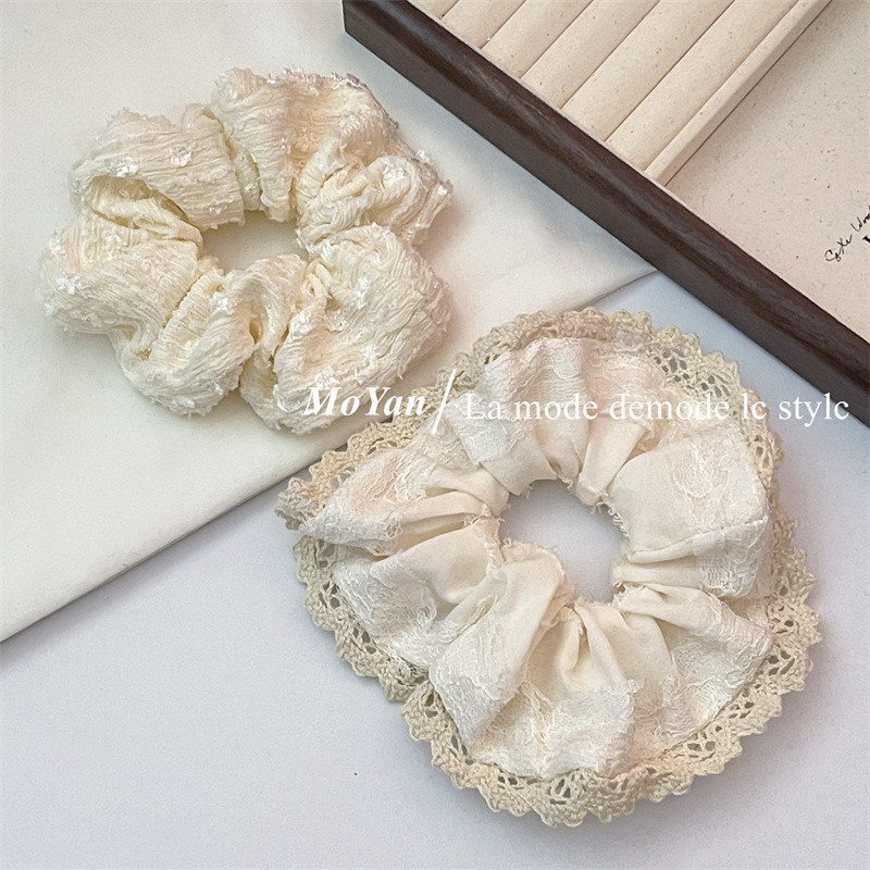 A small chanel-style cream white lace-trimmed large intestine hair band with a high-end feminine look, a bun hair tie, a hair tie, and an early spring hair accessory pic 2