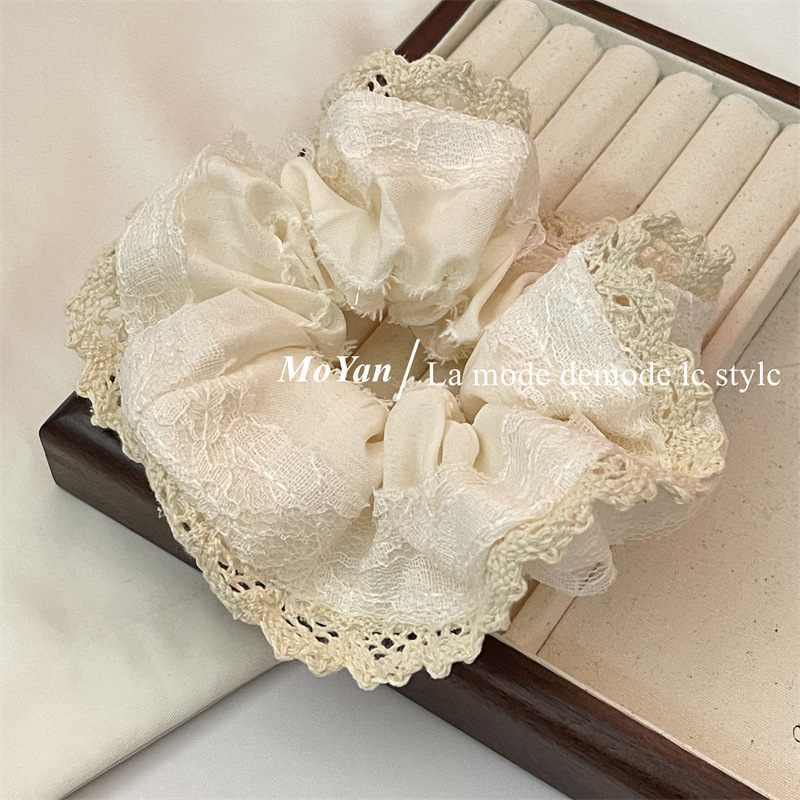 A small chanel-style cream white lace-trimmed large intestine hair band with a high-end feminine look, a bun hair tie, a hair tie, and an early spring hair accessory pic 9
