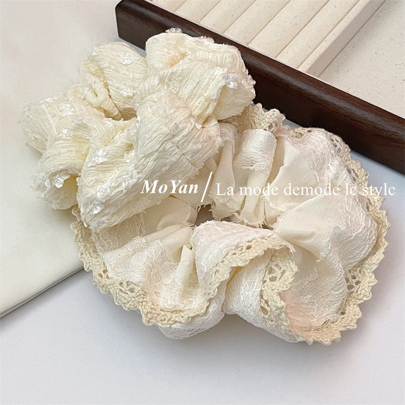 A small chanel-style cream white lace-trimmed large intestine hair band with a high-end feminine look, a bun hair tie, a hair tie, and an early spring hair accessory pic 7