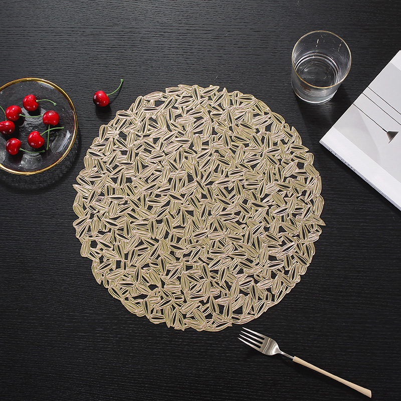 Womei Modern Creative round gold-embossed sunflower seed table MATS and placemats, Nordic light luxury hollowed-out waterproof, oil-proof, heat-resistant, anti-slip, wear-resistant and heat-insulating MATS, wholesale Western placemats pic 3