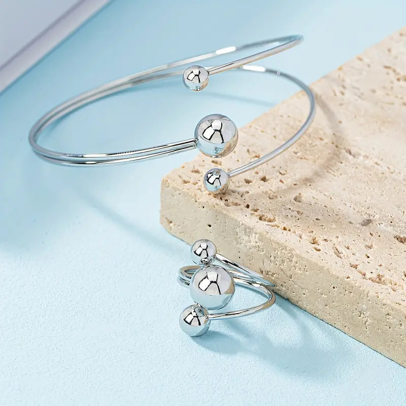 A simple, fashionable and personalized wrist and finger accessory set of gold and silver small balls with large balls in layers pic 8