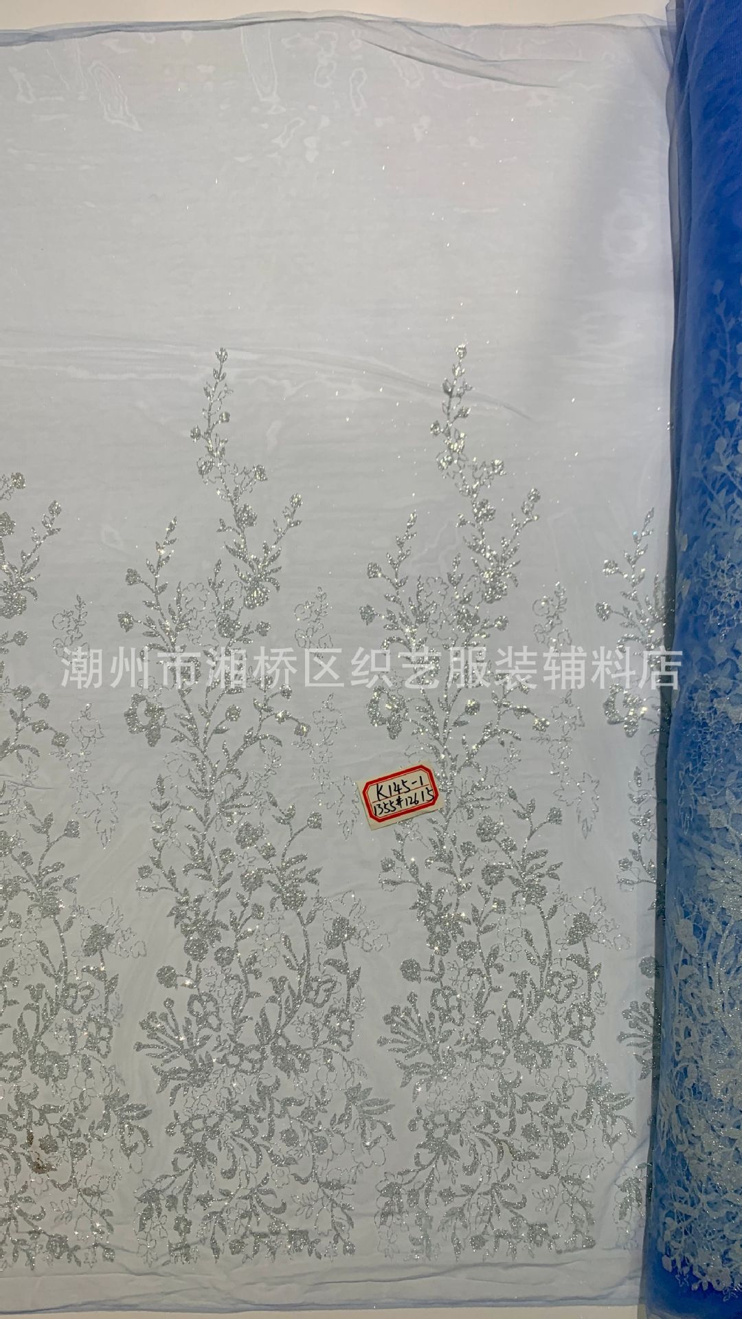 K145 patterned wedding dress fabric in stock, featuring a mesh fabric with gold sheets and gold spray patterns pic 11