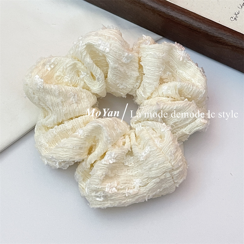A small chanel-style cream white lace-trimmed large intestine hair band with a high-end feminine look, a bun hair tie, a hair tie, and an early spring hair accessory pic 5