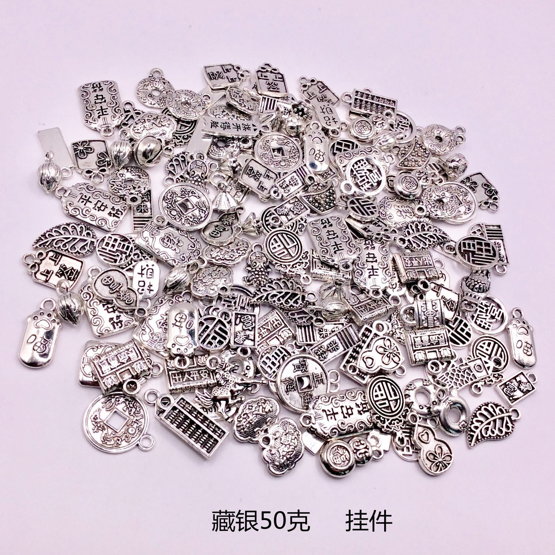 A 50g mixed bag of Tibetan silver bracelets, pendants, alloy jewelry accessories, diy flower trays, spacers, and drum beads pic 5