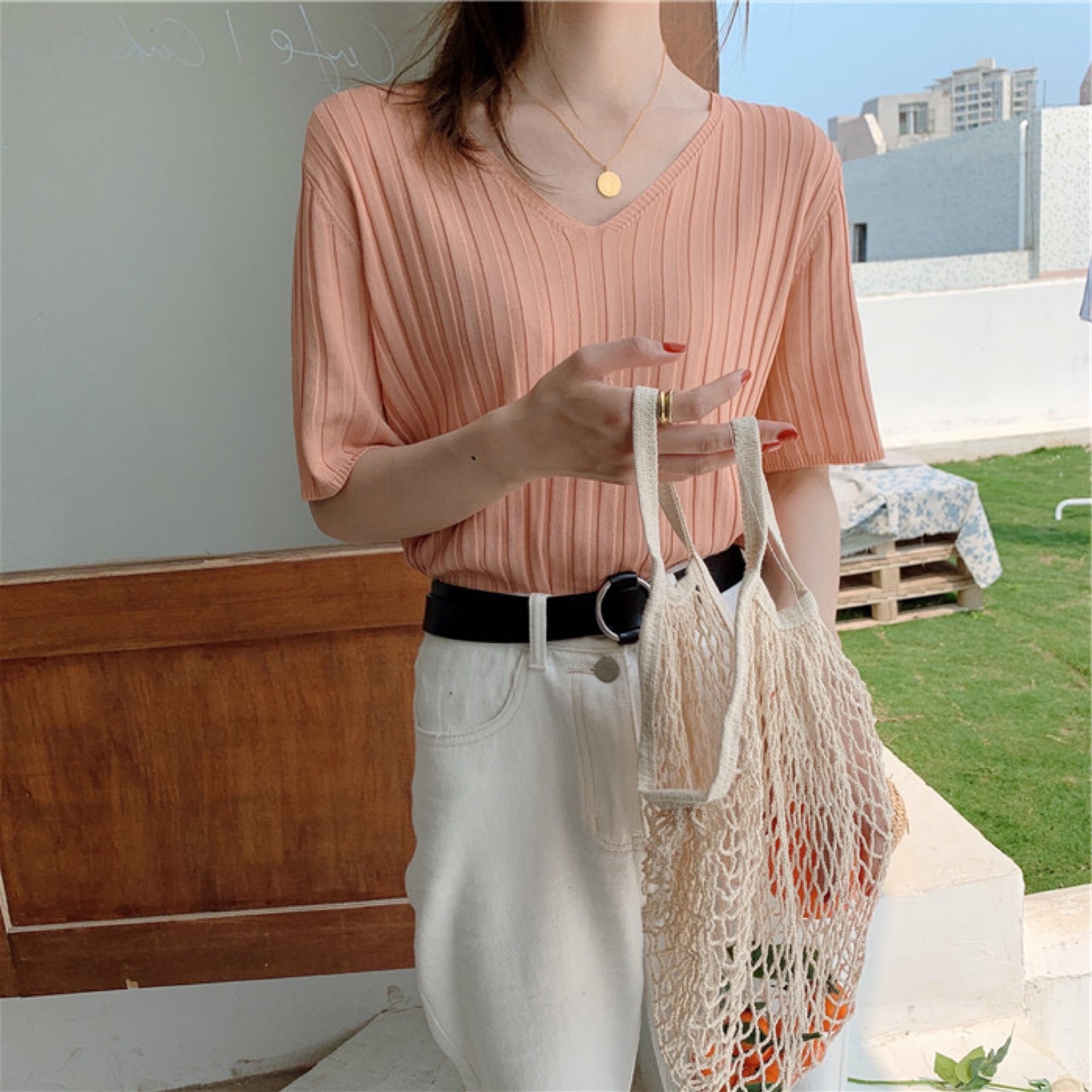 This ice silk short-sleeved V-neck knitted sweater is a summer base T-shirt for women. It can be worn over a thin, loose black chanel-style top pic 17