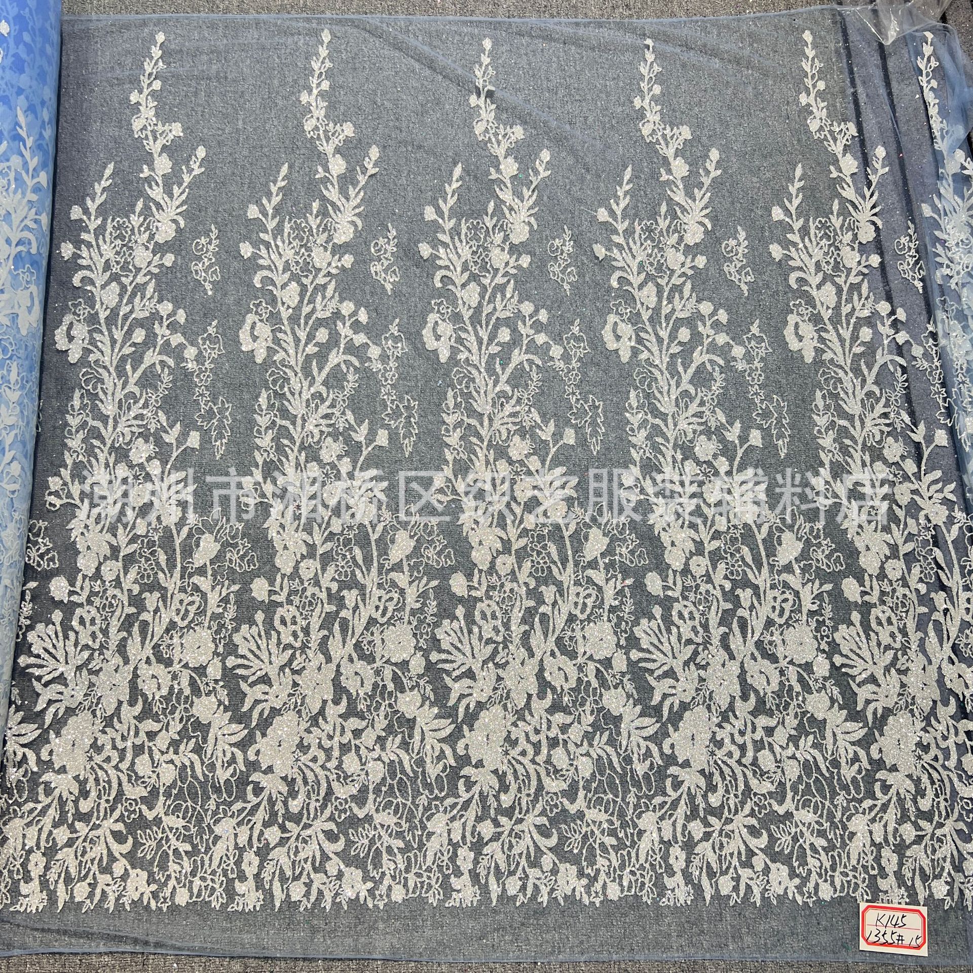 K145 patterned wedding dress fabric in stock, featuring a mesh fabric with gold sheets and gold spray patterns pic 3