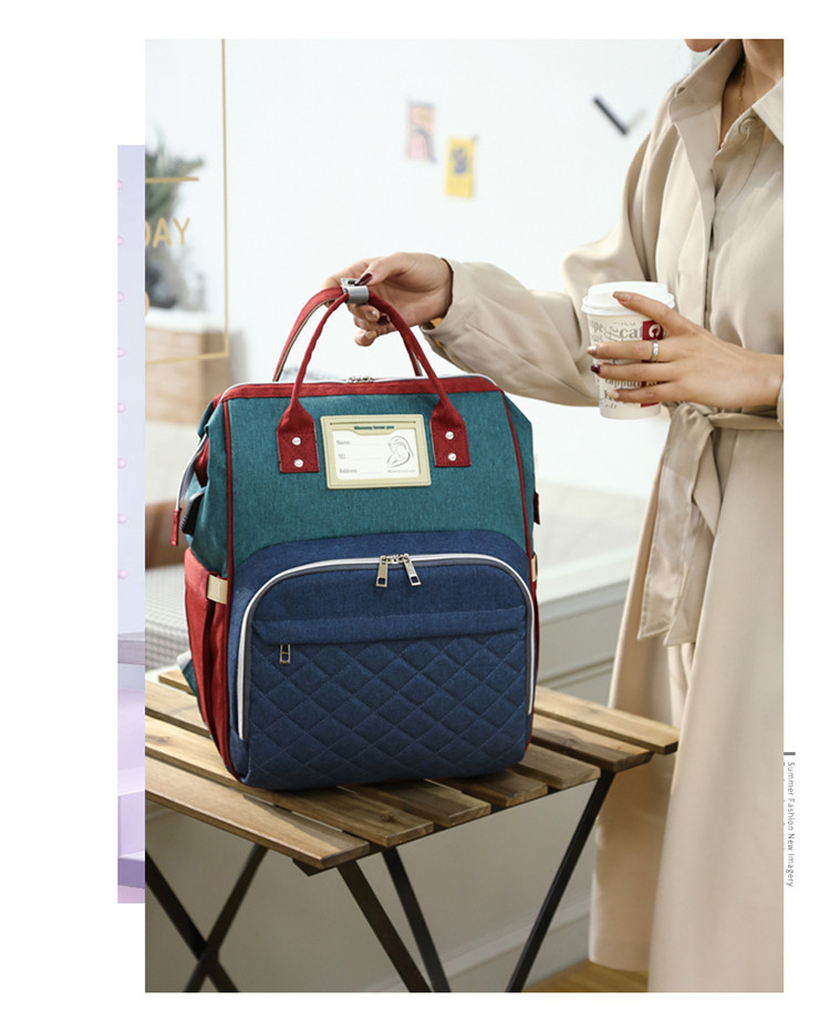 Nuevo modelo mommy bag cama cama plegable baby bag mamá multifuncional recargable impermeable bordado hilo mochila cama cross-border blast pic 22