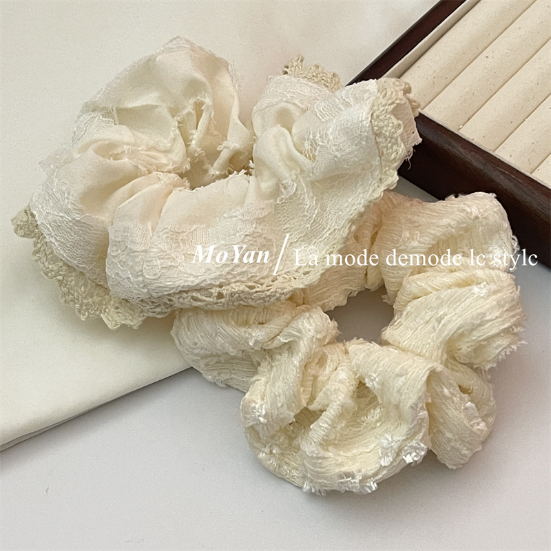 A small chanel-style cream white lace-trimmed large intestine hair band with a high-end feminine look, a bun hair tie, a hair tie, and an early spring hair accessory pic 14