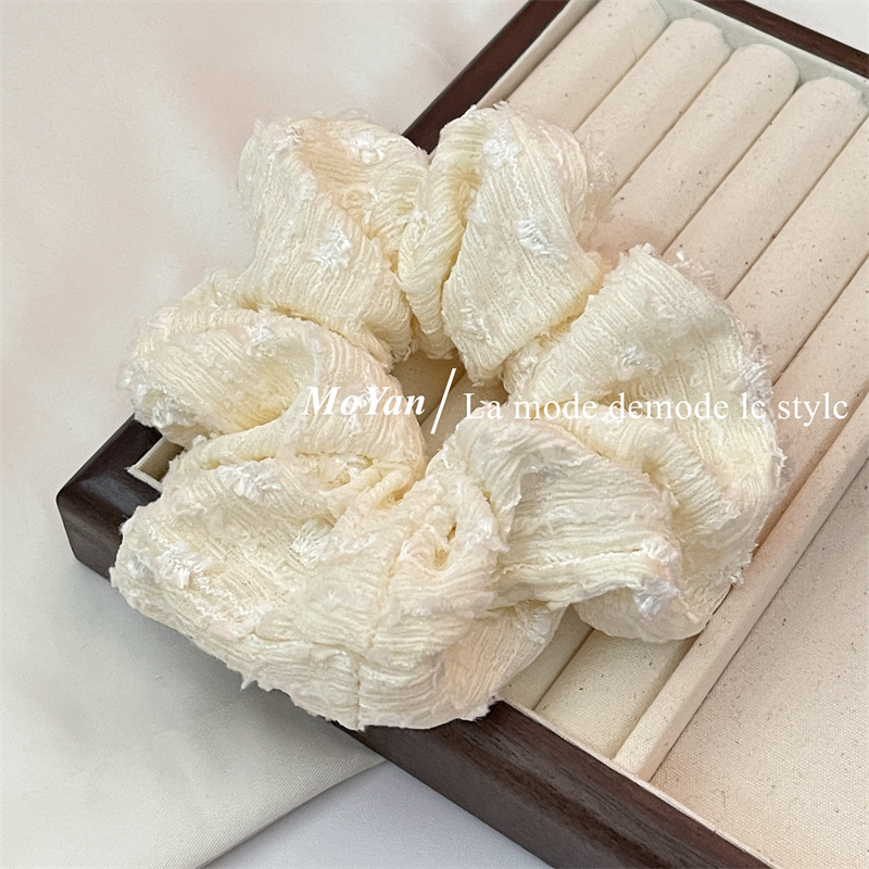 A small chanel-style cream white lace-trimmed large intestine hair band with a high-end feminine look, a bun hair tie, a hair tie, and an early spring hair accessory pic 8