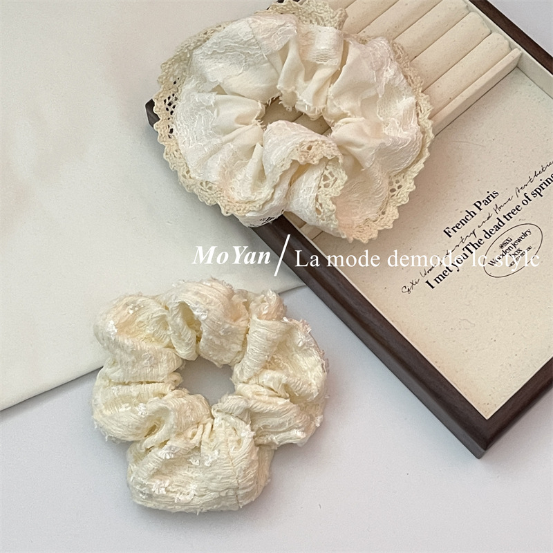 A small chanel-style cream white lace-trimmed large intestine hair band with a high-end feminine look, a bun hair tie, a hair tie, and an early spring hair accessory pic 4
