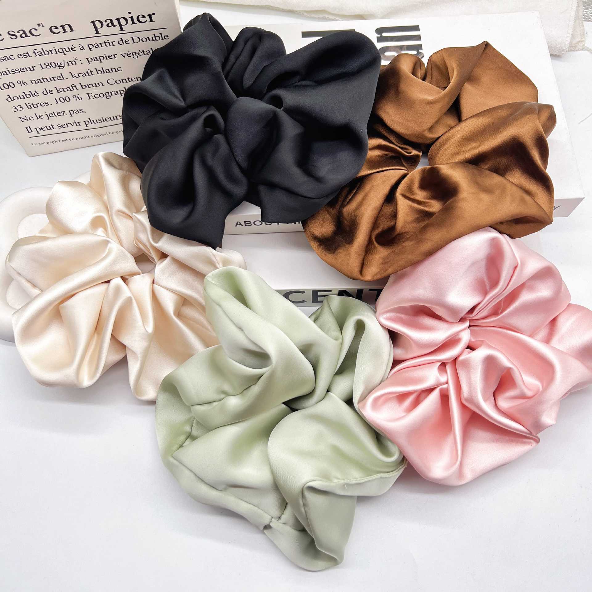 A retro French large intestine hair band for a woman with a simple and elegant ponytail bun. A hair tie, hair band, hair band and hair accessory for a woman pic 2