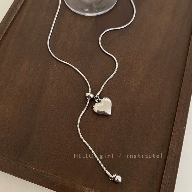 Minimalist silver heart-shaped pendant necklace for women, a light luxury and high-end style titanium steel pull-out long sweater chain accessory pic 6