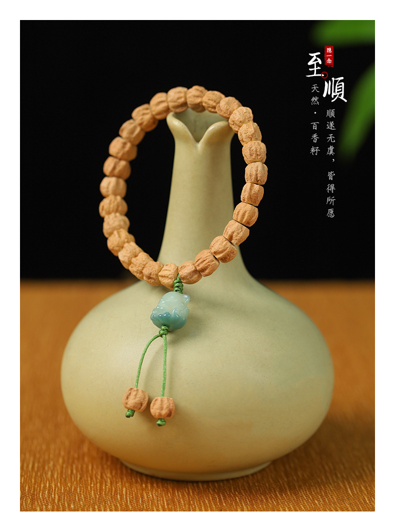 原创百香籽手串 天然百香籽鼓珠手串萌趣可爱猫爪招财猫国风醒狮文玩穗子手链批发工厂直销详情2