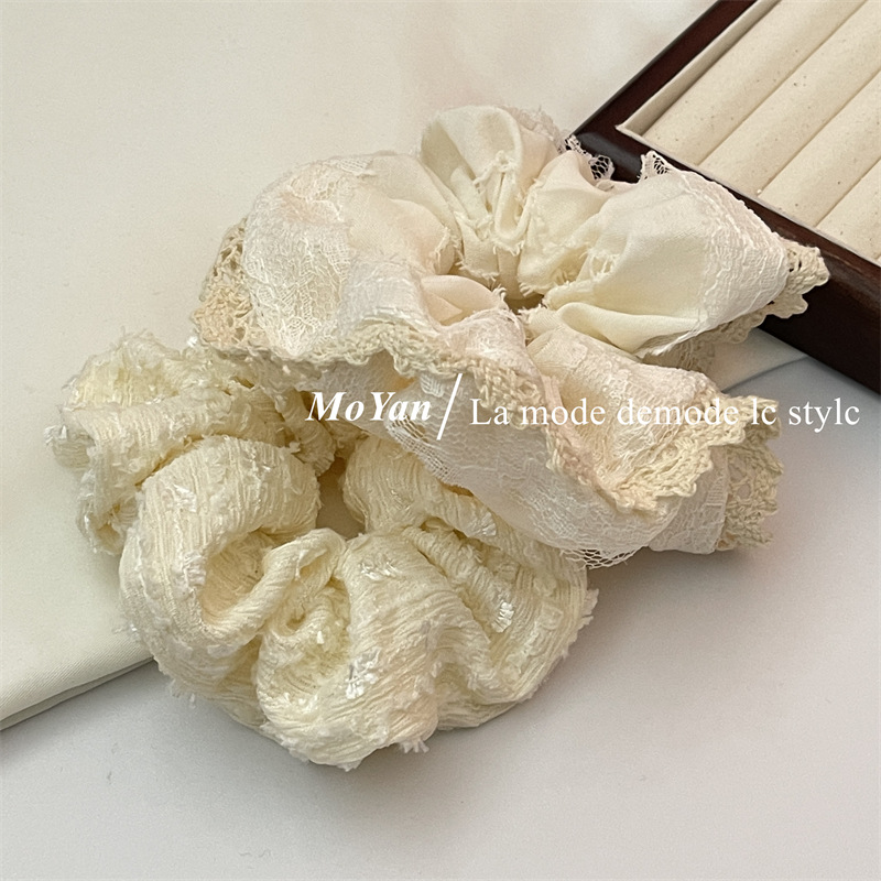 A small chanel-style cream white lace-trimmed large intestine hair band with a high-end feminine look, a bun hair tie, a hair tie, and an early spring hair accessory pic 15