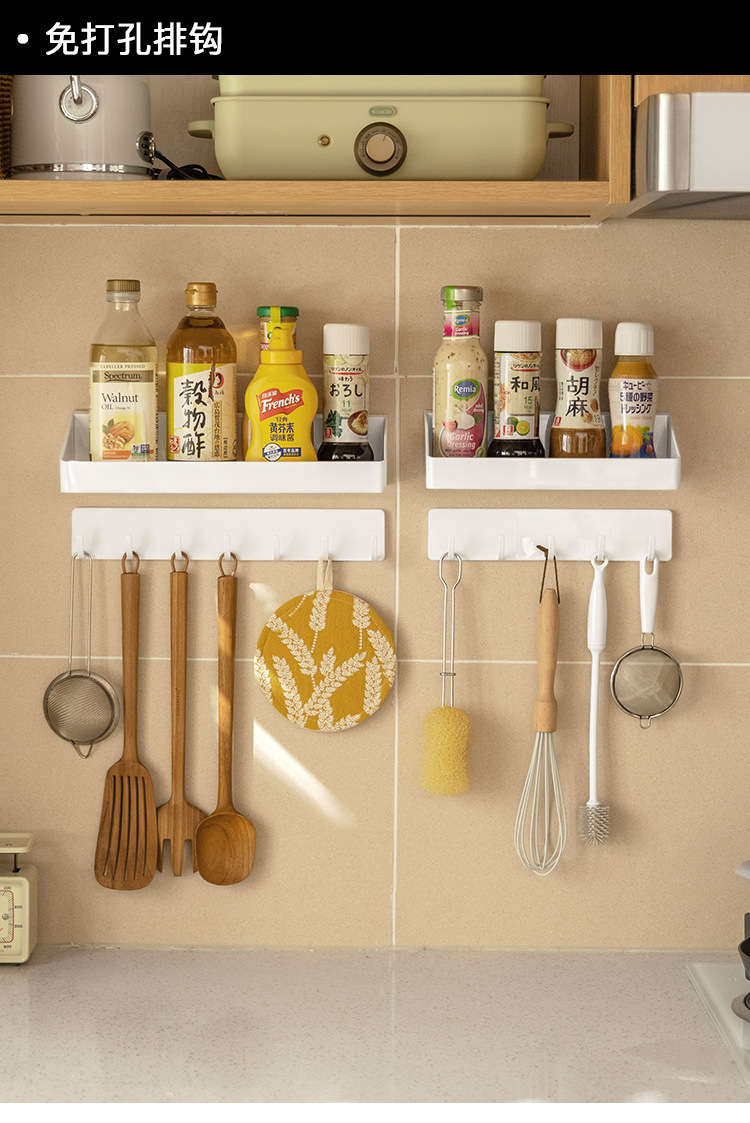 Simple hooks for hanging towels on the wall, a row of clothes hangers in the bathroom, long strips of adhesive, and a row of hooks for kitchen clothes without the need for drilling pic 1