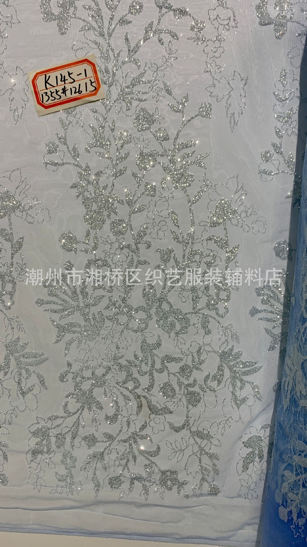 K145 patterned wedding dress fabric in stock, featuring a mesh fabric with gold sheets and gold spray patterns pic 9