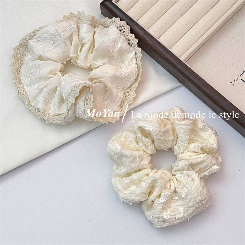 A small chanel-style cream white lace-trimmed large intestine hair band with a high-end feminine look, a bun hair tie, a hair tie, and an early spring hair accessory pic 3