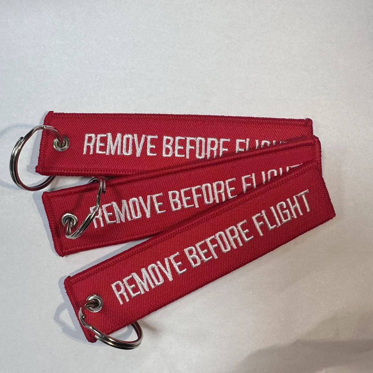 亚马逊刺绣红底白字飞行前摘除标签钥匙扣REMOVE BEFORE FLIGHT详情1