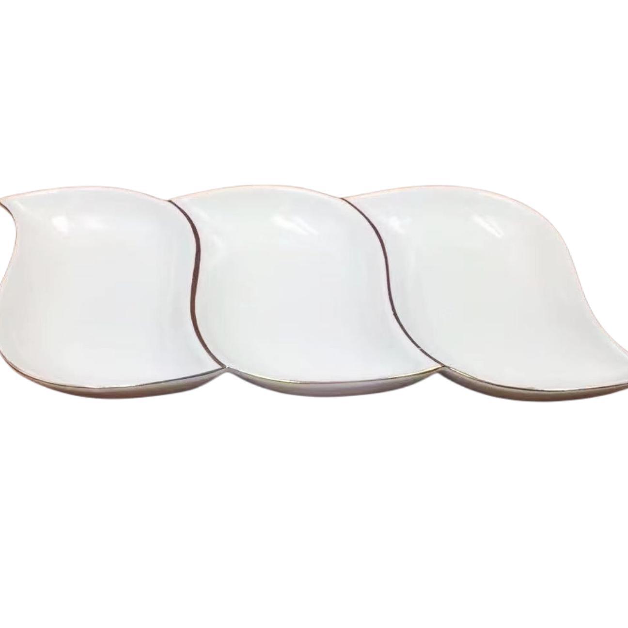 A pure white petal-shaped fruit platter with electroplated gold and multiple compartments, a hand-held restaurant banquet food platter pic 14